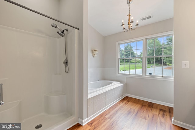 5722 Pond View Ln, Broad Run, VA 20137 - bathroom featuring a chandelier, wood finished floors, baseboards, a bath, and a shower