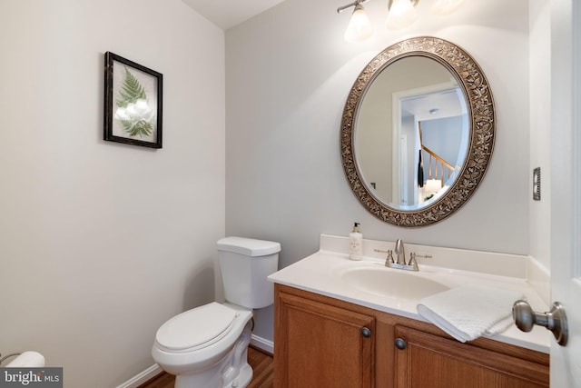 5722 Pond View Ln, Broad Run, VA 20137 - half bath featuring toilet, vanity, wood finished floors, and baseboards