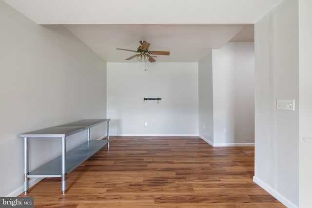 5722 Pond View Ln, Broad Run, VA 20137 - spare room featuring a ceiling fan, wood finished floors, and baseboards