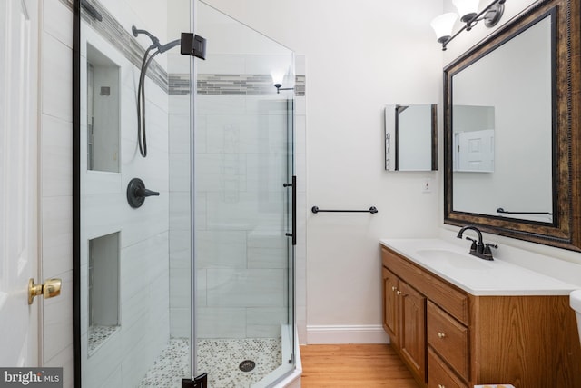 5722 Pond View Ln, Broad Run, VA 20137 - full bath with vanity, a stall shower, wood finished floors, and baseboards