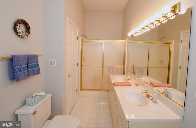 201 S Heron Dr Unit 11E, Ocean City, MD 21842 - bathroom with a shower stall, toilet, double vanity, and tile patterned flooring