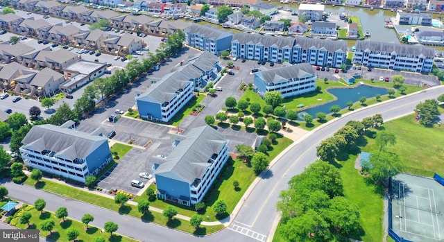 birds eye view of property featuring a water view