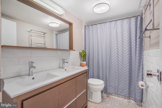 4201 Cathedral Ave NW Unit 616W, Washington, DC 20016 - full bath featuring double vanity, tasteful backsplash, tile patterned floors, and toilet