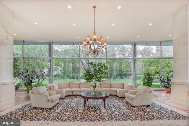 4201 Cathedral Ave NW Unit 616W, Washington, DC 20016 - living room with floor to ceiling windows, a chandelier, and healthy amount of natural light