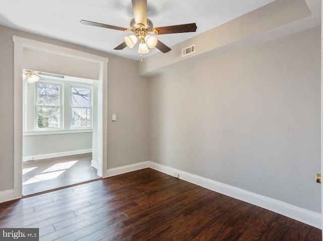 65 N Monastery Ave, Baltimore, MD 21229 - empty room with ceiling fan, visible vents, baseboards, and dark wood-type flooring