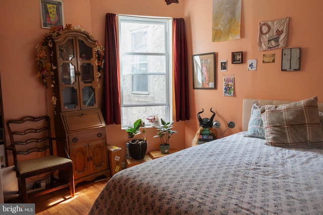 bedroom with light wood-type flooring