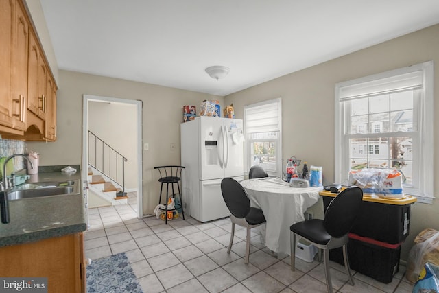 12714 Harborview Ct, Woodbridge, VA 22192 - dining area featuring stairway and light tile patterned flooring