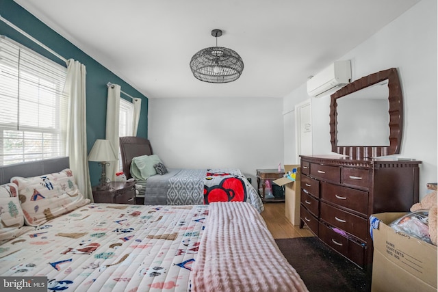 12714 Harborview Ct, Woodbridge, VA 22192 - bedroom with wood finished floors and a wall unit AC