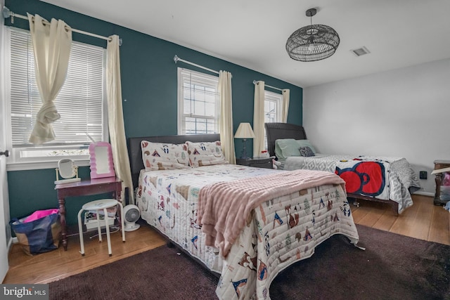 12714 Harborview Ct, Woodbridge, VA 22192 - bedroom featuring visible vents, multiple windows, and wood finished floors