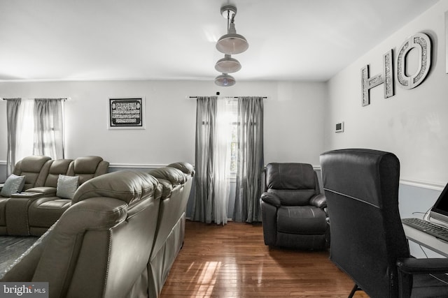 12714 Harborview Ct, Woodbridge, VA 22192 - home theater with dark wood-style floors and a wealth of natural light