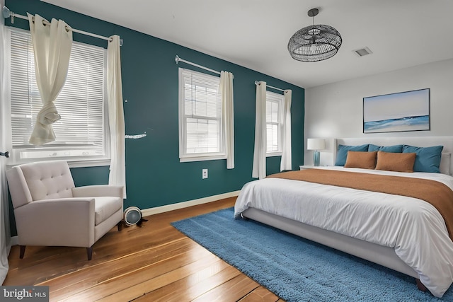 12714 Harborview Ct, Woodbridge, VA 22192 - bedroom with baseboards, visible vents, and hardwood / wood-style floors