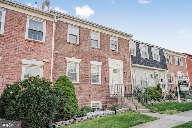 multi unit property featuring brick siding