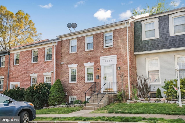 12714 Harborview Ct, Woodbridge, VA 22192 - view of front of house featuring a shingled roof and brick siding