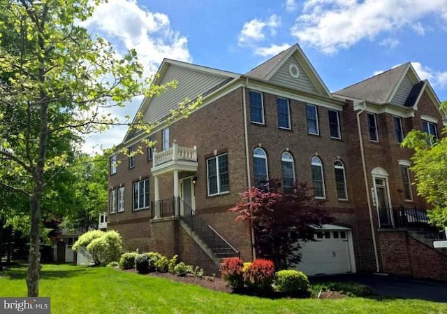 4102 Chariot Way, Upper Marlboro, MD 20772 - view of front of house featuring brick siding, a garage, a front yard, and stairs