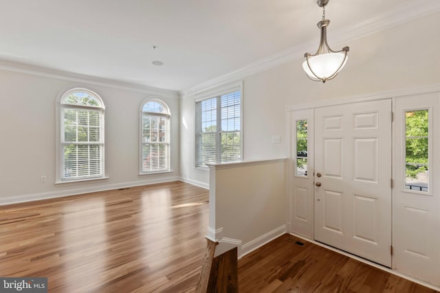 4102 Chariot Way, Upper Marlboro, MD 20772 - foyer entrance featuring crown molding, plenty of natural light, wood finished floors, and baseboards