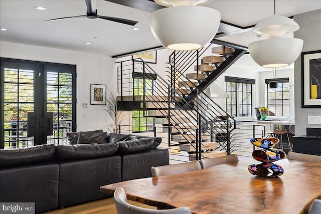 dining space with stairway, ceiling fan, recessed lighting, and wood finished floors