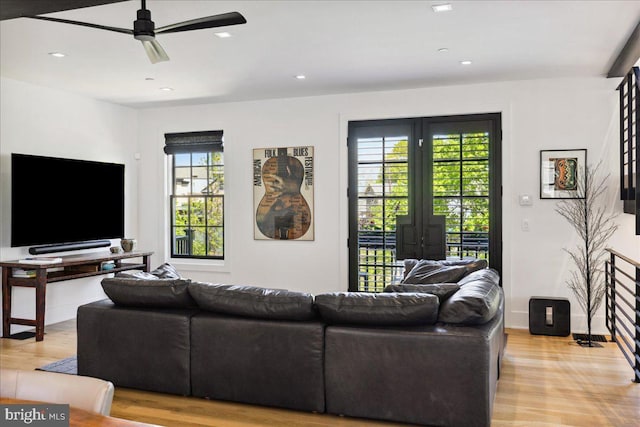 living room featuring a ceiling fan, recessed lighting, french doors, and light wood finished floors
