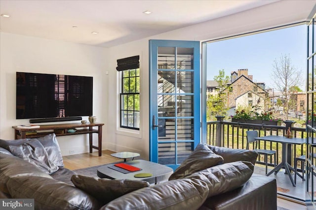 living area featuring baseboards and wood finished floors
