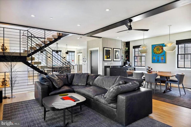 living room with stairs, recessed lighting, ceiling fan, and wood finished floors