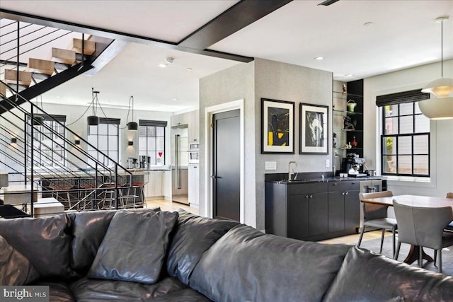 living area with stairs, recessed lighting, and built in features