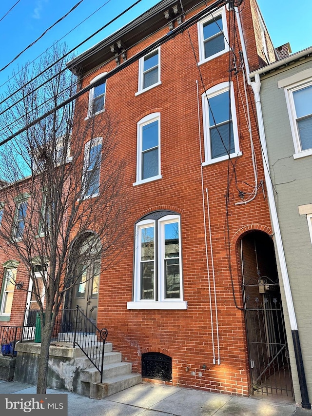 view of front of home with brick siding