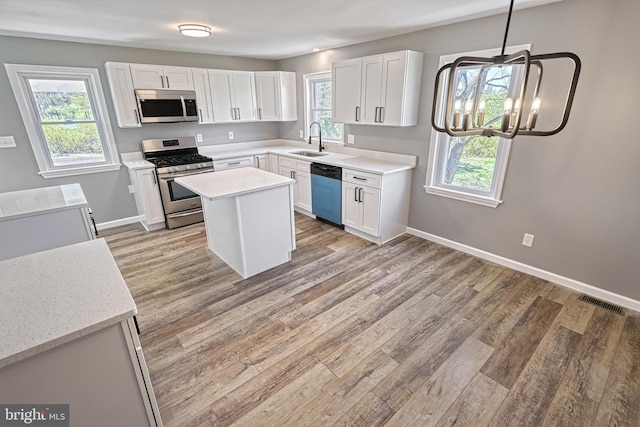 35 Herrs Ridge Rd, Gettysburg, PA 17325 - kitchen featuring a sink, light wood-style flooring, white cabinets, and stainless steel appliances