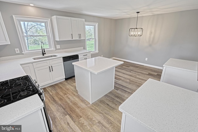 35 Herrs Ridge Rd, Gettysburg, PA 17325 - kitchen with gas range, stainless steel dishwasher, light wood-type flooring, a sink, and white cabinets