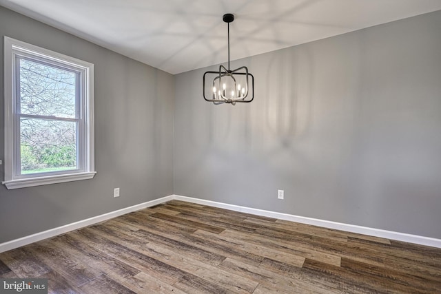 35 Herrs Ridge Rd, Gettysburg, PA 17325 - empty room featuring baseboards, plenty of natural light, dark wood-style flooring, and a chandelier