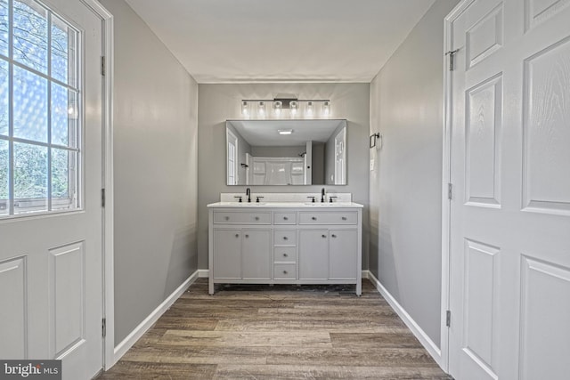 35 Herrs Ridge Rd, Gettysburg, PA 17325 - bathroom featuring double vanity, a sink, baseboards, and wood finished floors