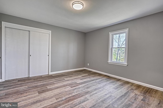 35 Herrs Ridge Rd, Gettysburg, PA 17325 - unfurnished bedroom with baseboards, wood finished floors, and a closet