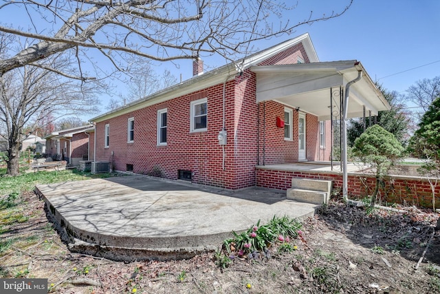 35 Herrs Ridge Rd, Gettysburg, PA 17325 - view of property exterior featuring a porch, central AC unit, brick siding, and a chimney