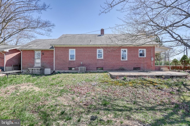 35 Herrs Ridge Rd, Gettysburg, PA 17325 - back of house featuring brick siding, roof with shingles, a chimney, and cooling unit