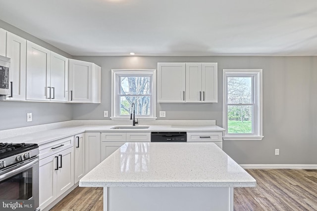 35 Herrs Ridge Rd, Gettysburg, PA 17325 - kitchen with a center island, white cabinetry, a sink, light wood finished floors, and appliances with stainless steel finishes