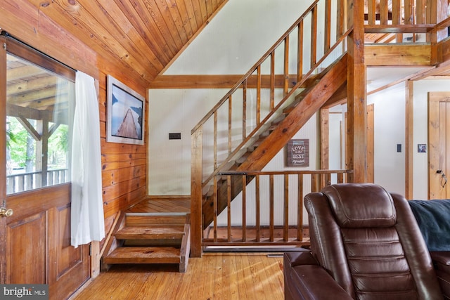 2 Heights Ct, Ruther Glen, VA 22546 - staircase with hardwood / wood-style flooring, vaulted ceiling, wooden walls, and wood ceiling