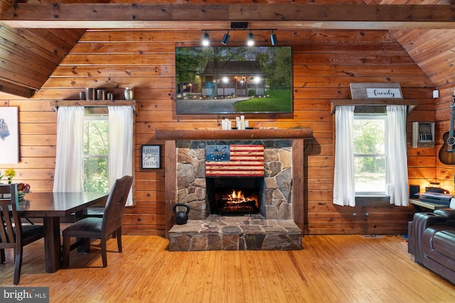 2 Heights Ct, Ruther Glen, VA 22546 - living area with wood-type flooring, wooden ceiling, wooden walls, and a stone fireplace