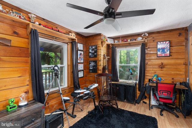 2 Heights Ct, Ruther Glen, VA 22546 - office area featuring wood walls, ceiling fan, wood finished floors, and a textured ceiling