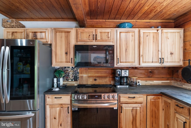 2 Heights Ct, Ruther Glen, VA 22546 - kitchen with stainless steel appliances, wooden ceiling, dark countertops, wood walls, and light brown cabinetry