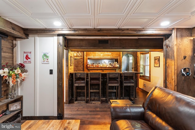2 Heights Ct, Ruther Glen, VA 22546 - living room with wooden walls, dark wood-style flooring, an ornate ceiling, bar, and recessed lighting