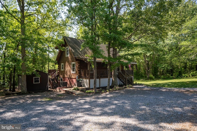 2 Heights Ct, Ruther Glen, VA 22546 - view of property exterior with stairs, log siding, and a porch