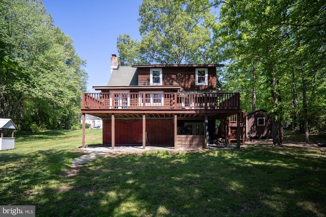 2 Heights Ct, Ruther Glen, VA 22546 - rear view of property featuring a deck, a chimney, a lawn, an outdoor structure, and a patio