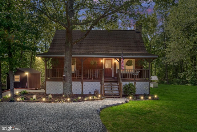 2 Heights Ct, Ruther Glen, VA 22546 - view of front of house with a porch, a front yard, an outbuilding, stairs, and a chimney