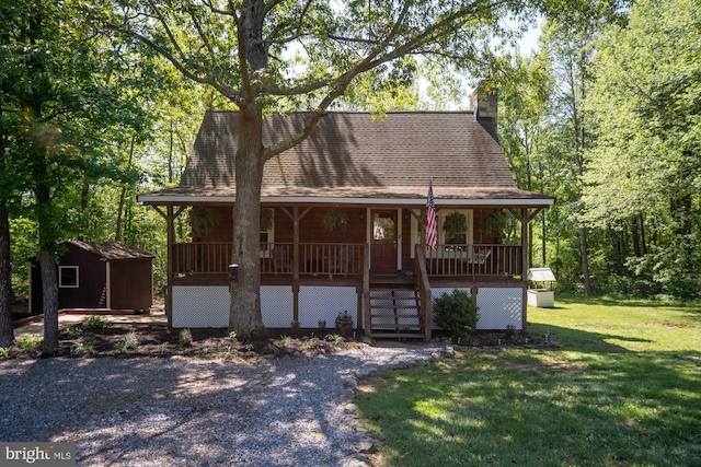 2 Heights Ct, Ruther Glen, VA 22546 - view of front facade featuring covered porch, a front yard, an outbuilding, a chimney, and a shed