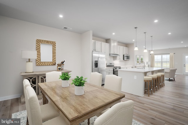 dining space featuring visible vents, recessed lighting, baseboards, and light wood-type flooring