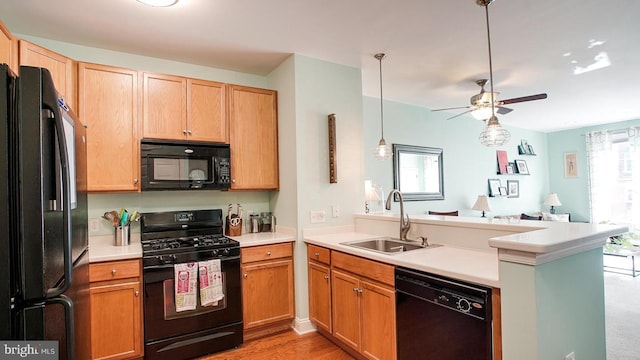 300 W Elm St Unit 2206, Conshohocken, PA 19428 - kitchen with black appliances, a sink, a peninsula, a ceiling fan, and open floor plan