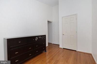 unfurnished bedroom featuring baseboards and light wood-type flooring