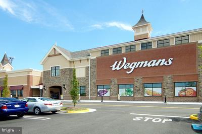 view of building exterior featuring uncovered parking