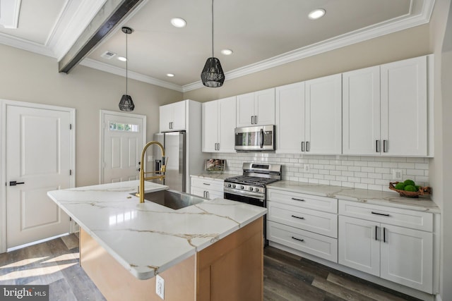 2817 Ulman Ave, Baltimore, MD 21215 - kitchen with appliances with stainless steel finishes, an island with sink, tasteful backsplash, dark wood-style floors, and crown molding