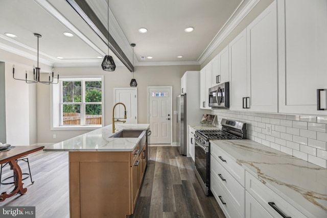 2817 Ulman Ave, Baltimore, MD 21215 - kitchen featuring stainless steel appliances, a sink, dark wood finished floors, a kitchen island with sink, and a chandelier