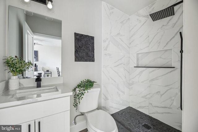 2817 Ulman Ave, Baltimore, MD 21215 - bathroom featuring toilet, vanity, and a marble finish shower