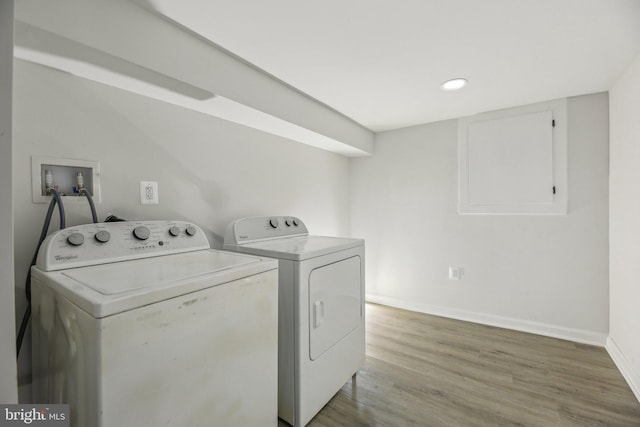 2817 Ulman Ave, Baltimore, MD 21215 - laundry area with washing machine and clothes dryer, light wood-style flooring, baseboards, and recessed lighting